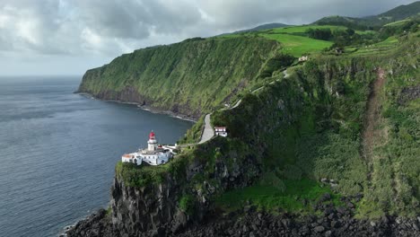 Farol-Ponta-do-Arnel-on-rocky-headland,-Nordeste,-Sao-Miguel