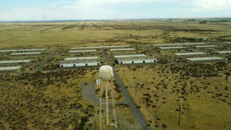 us, oregon, umatilla, 2025-08-03 - drone view of a water tower and abandoned buildings at the former umatilla chemical depot