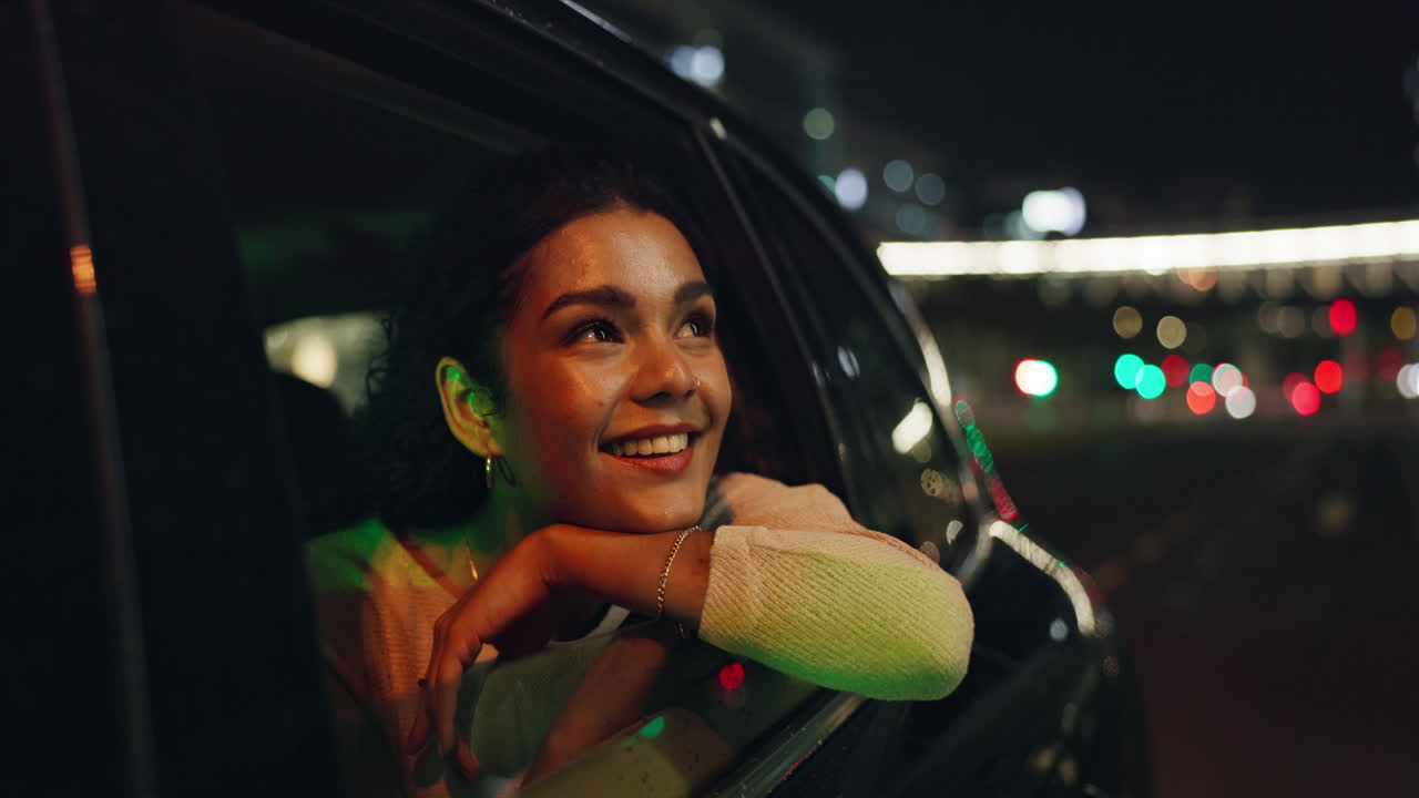 Woman enjoying a night ride in the city
