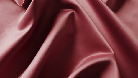 close-up van rode glanzende zijden doek in slow motion