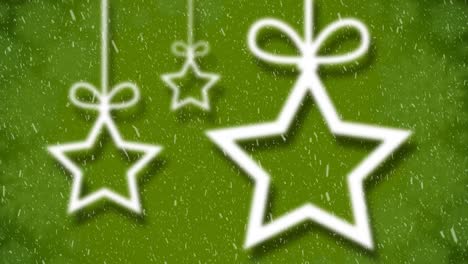 Animation-of-star-christmas-decoration-with-snow-falling-on-green
