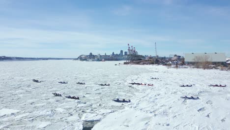 Epic-Drone-shot,-following-canoe-ice-racing-teams-Part-4