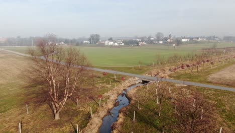 Aerial-of-riparian-buffer,-trees-and-vegetation-protecting-stream,-water-quality-from-sediment-and-nutrient-runoff,-EPA-controls