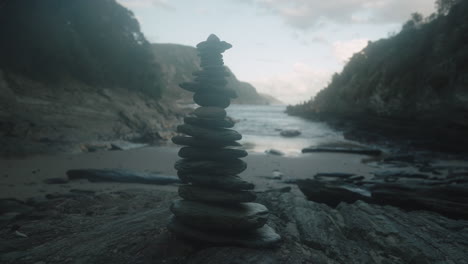 rocks stacked and balanced on a wild beach