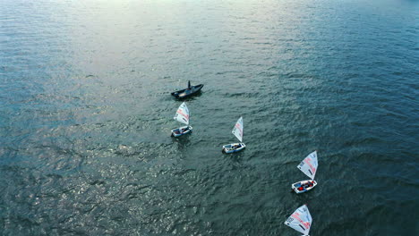 optimist dinghy sailing on the blue waters of baltic sea in poland