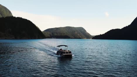 Aerial-drone-shot-of-boat-in-Indian-Arm,-an-ocean-in-Vancouver,-Canada