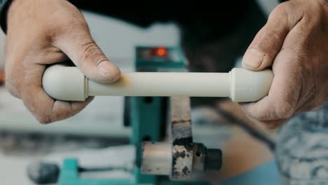 Soldering of water supply or heating pipes close up. The plumber solders the adapter to the pipe. Repair work on the construction site. Room renovation.