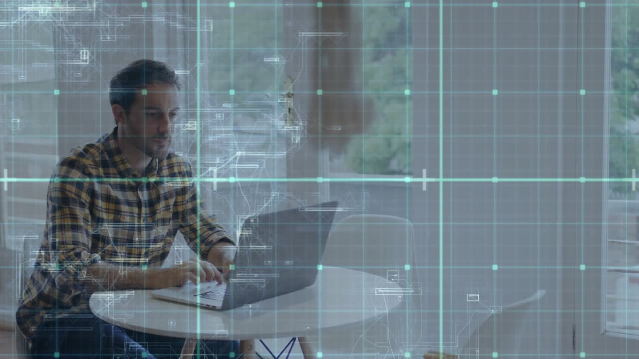 Man typing on laptop by window, input initiating HUD grid shifting, showing tech data for designers