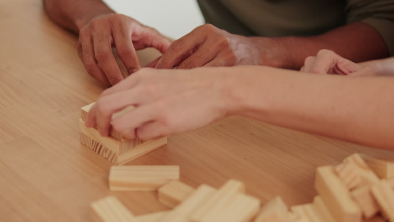 Couple Playing Block Game at Home