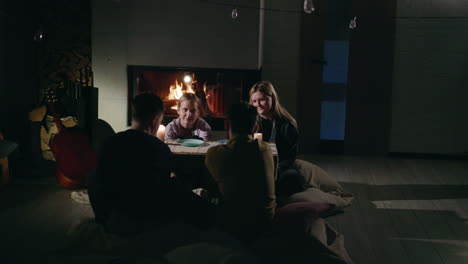 friends and family dinner by the fireplace