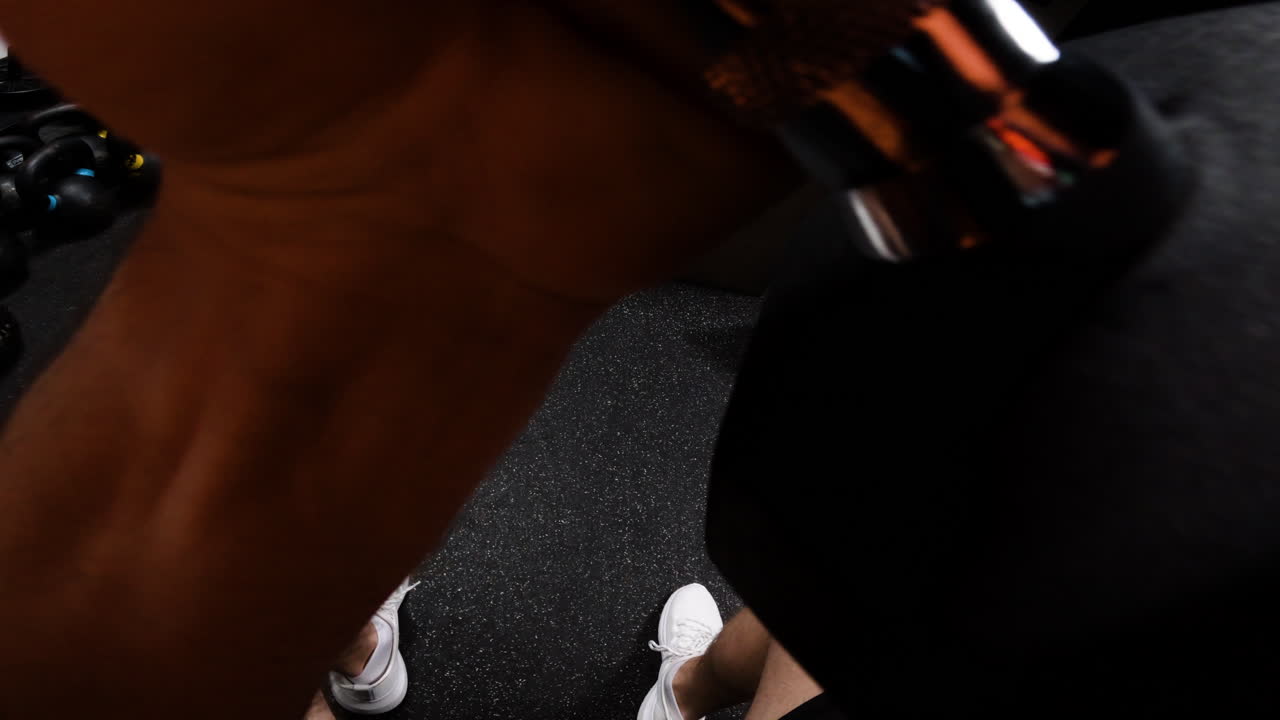 Man working out with dumbbells in the gym