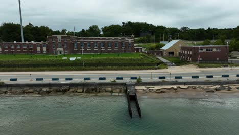 A-government-stone-structure-close-to-the-water-on-a-dark-and-stormy-day