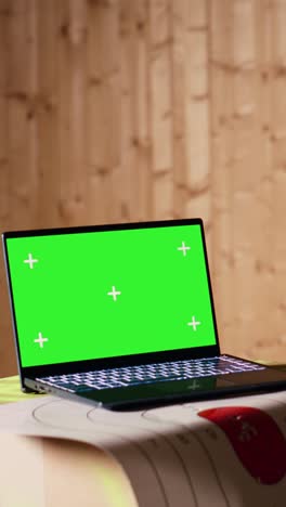 vertical video mockup notebook and person training with handguns on bullseye