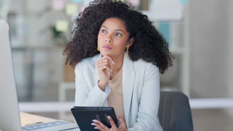 serious african businesswoman using digital tablet