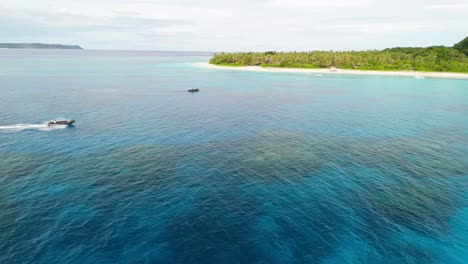 Small-tender-from-cruise-ship-takes-snorkelers-to-coral-reef-off-the-coast-of-an-island-in-Fiji