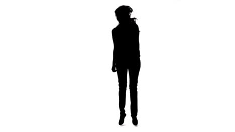 silhouette of a jumping woman in slow motion