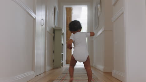 happy baby girl learning to walk toddler exploring home curious infant walking through house enjoying childhood