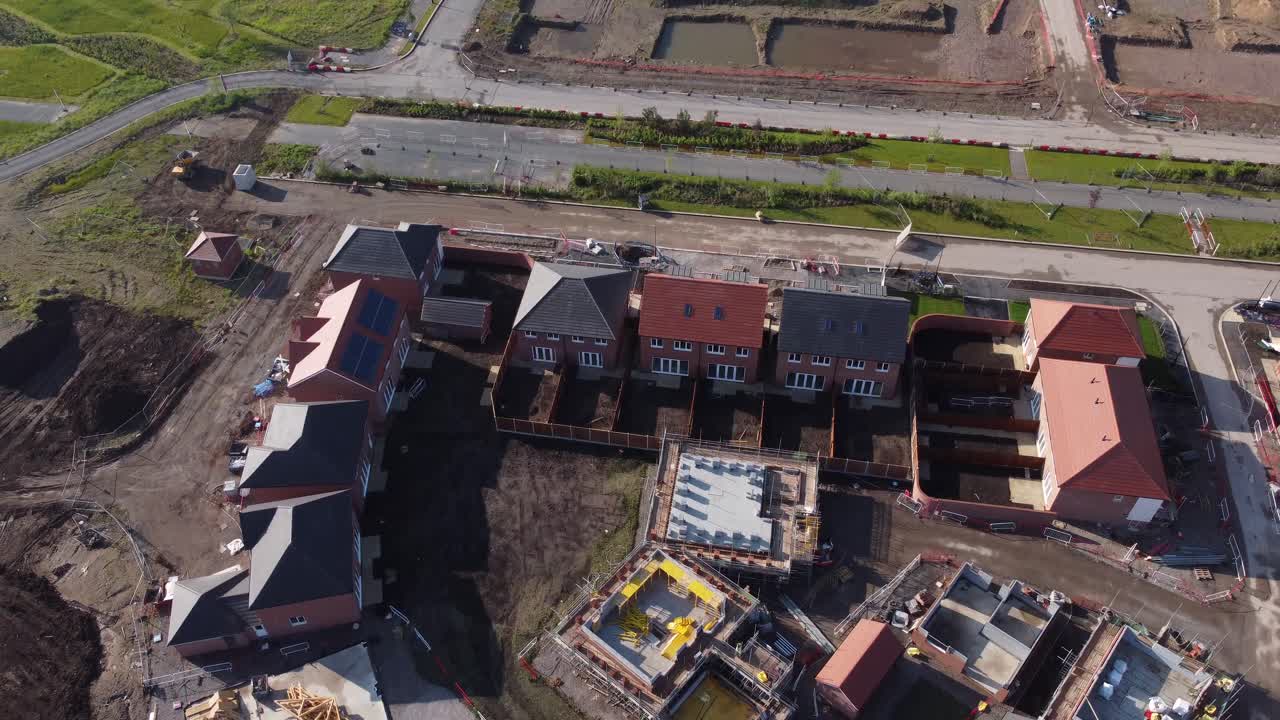 Drone aerial view of house building site in Cheshire, England, UK, Europe, illustrating urban development due to housing shortage in the UK.