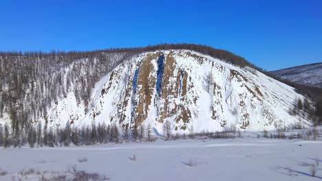 drone flyover near a beautiful mountain in winter 4k