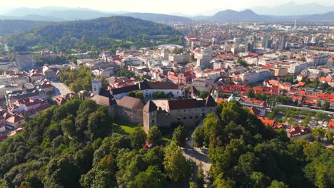 stunning drone footage of ljubljana, slovenia, showcasing the charming old town, the medieval castle, and the vibrant city center with its picturesque streets and unique architecture