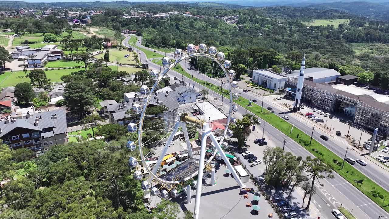Aerial View of a Ferris Wheel in a City