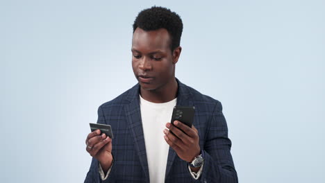 Happy-black-man,-phone-and-credit-card-for-payment