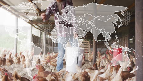 Male farmer feeding chickens inside wooden coop, showing agriculture data world map overlay