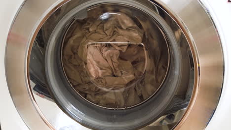 washing machine full of dirty clothes