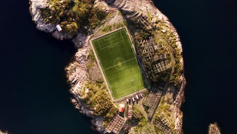 top-down close-up aerial 360 of the henningsvær soccer field, lofoten islands, norway