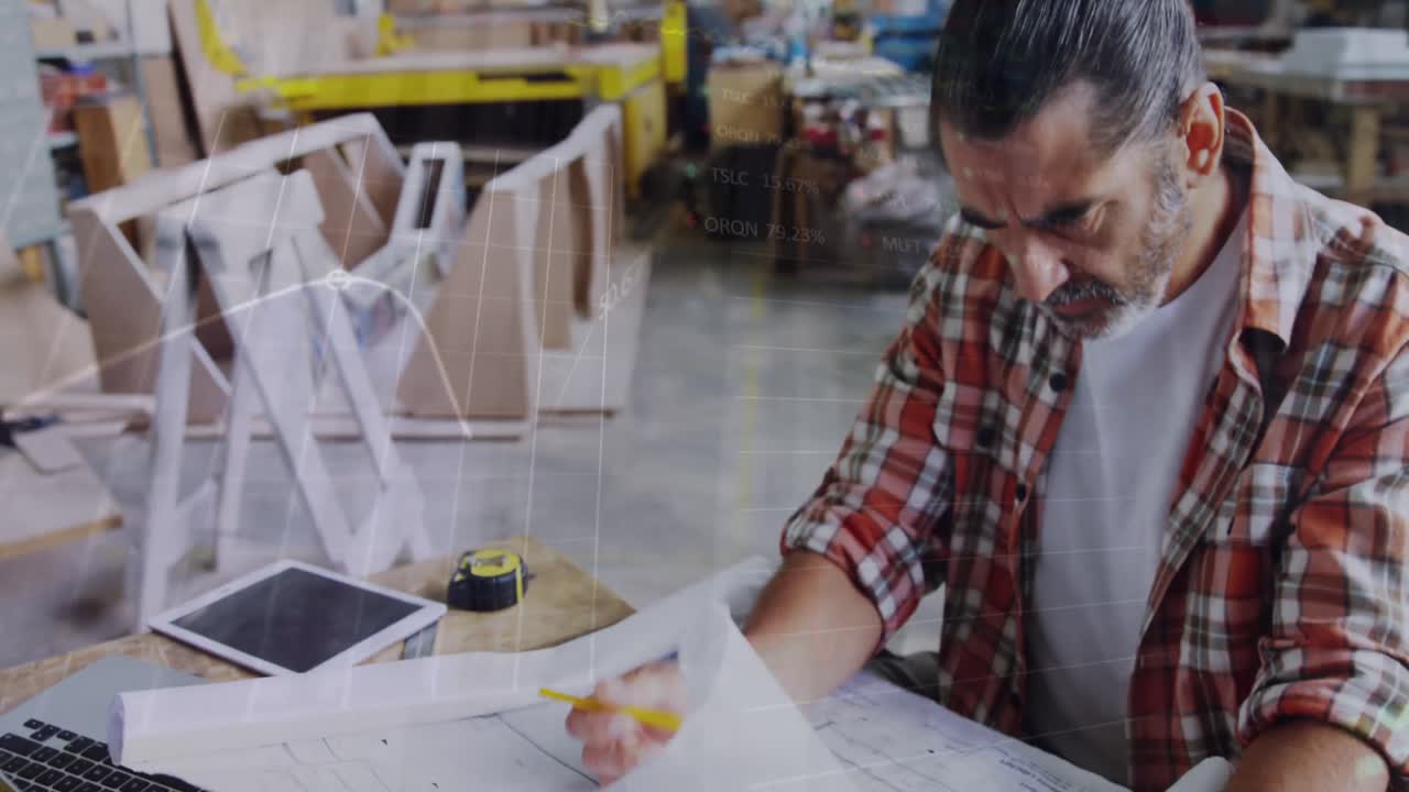 Animation of financial graphs over senior caucasian man in carpentry workshop