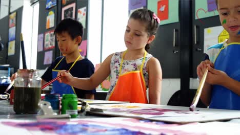 animation of falling hearts over group of diverse children painting