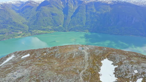majestic aerial view of sogndal, norway with the sognefjord, lush mountains, and sogndal bridge under clear skies. breathtaking nordic landscape in soft natural light