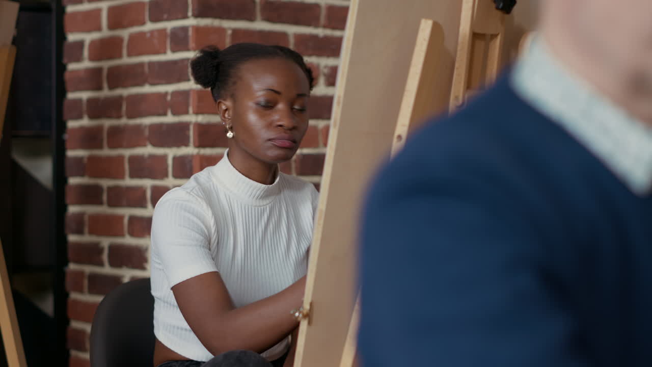 Future artist drawing professional sketch on canvas with easel