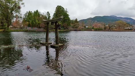 Stone-torii-gate-standing-in-a-lake