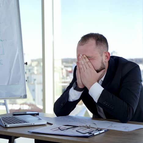 tired office worker freelancer. stressful businessman at work in the office