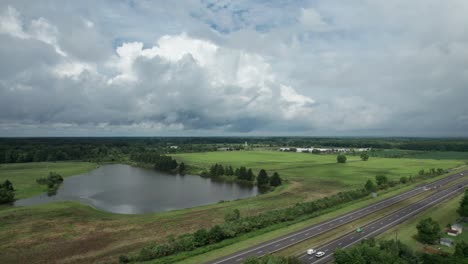 aerial shot of stunning natural lake with shrubberies near highway, ohio, usa