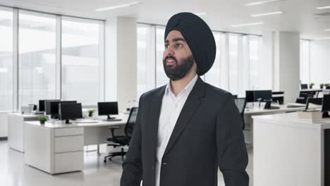 tensed sikh indian businessman waiting for someone