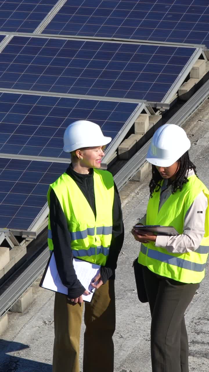 Construction Workers Inspecting Solar Panels