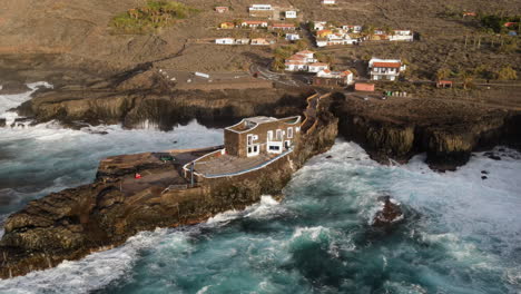 aerial-shot-in-distance-to-the-smallest-hotel-in-the-world-located-on-the-island-of-El-Hierro,-in-the-Canary-Islands