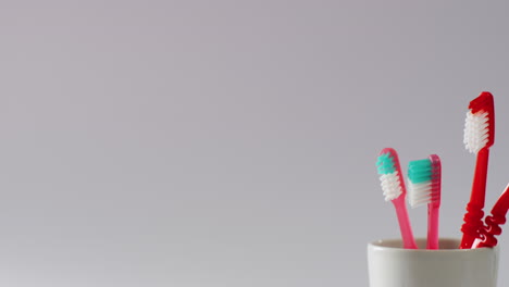 video of close up of toothbrushes on white background