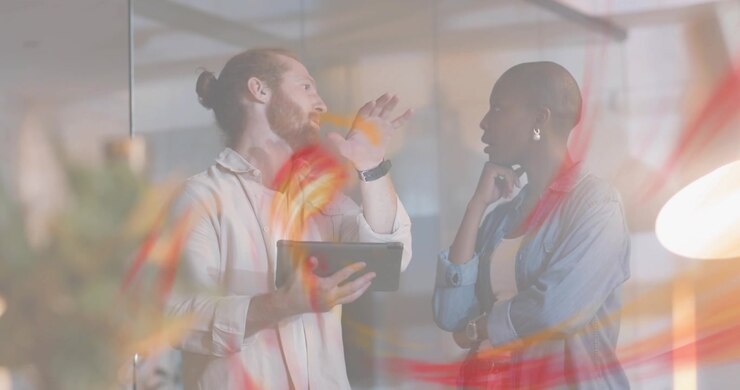 man tapping tablet and starting swirl while woman accepting it and exploring business data