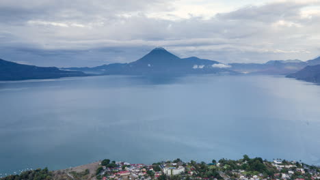 slow aerial hyperlapse of panajachel with lake atitlan and volcan atitlan in the background