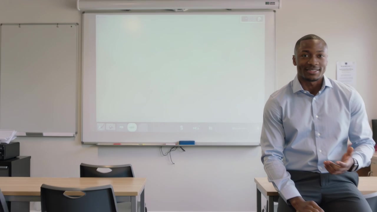 Entering right teacher sitting, teaching in classroom with blank screen, blue shirt, copy space