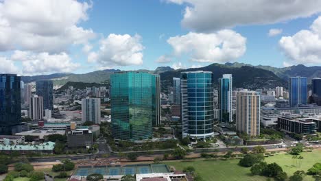 aerial rising and panning shot of downtown honolulu on the island of o'ahu, hawaii