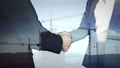 animation of business texts over cityscape and caucasian businessmen shaking hands