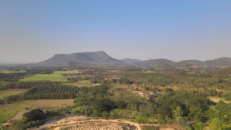 Beautiful-Aerial-Scenery-of-the-Landscape-in-Thailand-with-Mountainous-Background-and-Blue-Skies