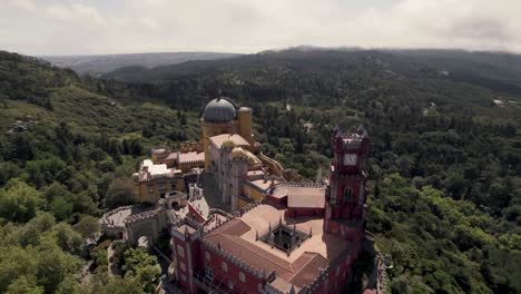 Panoramic-view-of-well-preserved-colorful-terraces-and-battlement,-Pena-palace-on-the-hill-in-Sintra