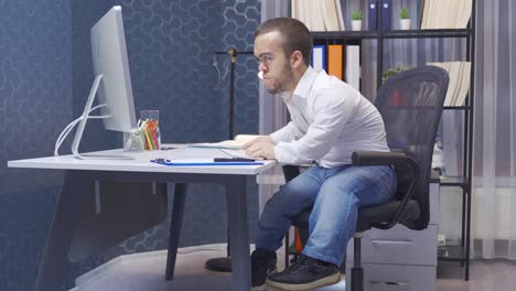 Disabled-midget-man-stressed-by-his-job.-He-works-in-his-office.