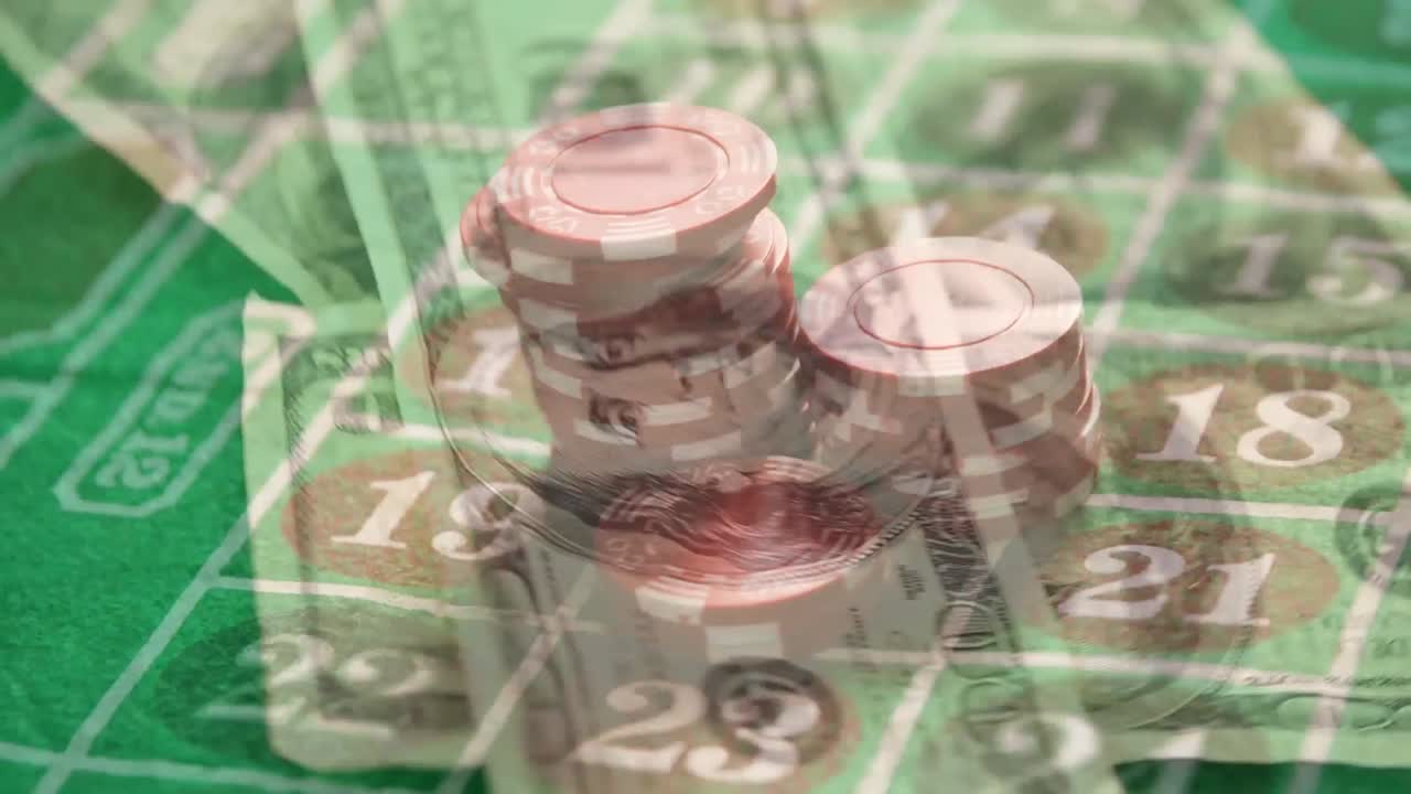 Gambling chips placed on a roulette grid with banknotes in the foreground