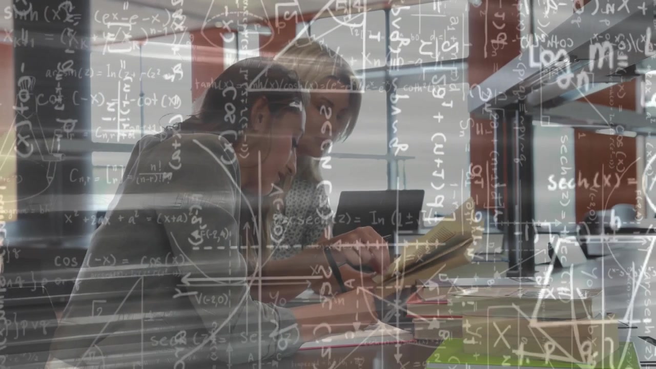 tutor opening textbook and showing animated formulas while student writing notes for math education